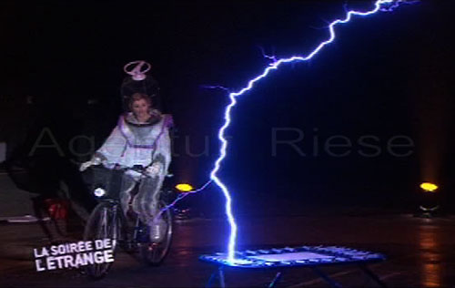 Woman on bike in electrical storm